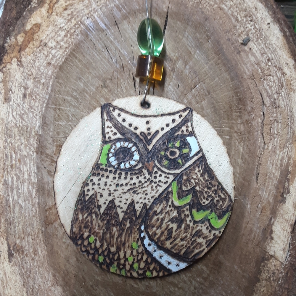 Woodburnt and painted ornament